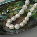 Baroque irregular white pearls with high luster displayed in a natural abalone shell - 12# Faceted Oval Shell Bead / Approx. 11.4*12.6mm