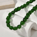 Close-up of deep green irregular baroque glass beads for DIY jewelry making - Green Irregular Shape