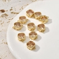 Macro detail of 14k gold-plated square champagne zircon pendant with hollow base pattern - Champagne Zirconia Square / Champagne
