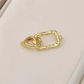 Macro shot of 14k gold plated textured rectangular clasp and spring ring connector - Gold Square Style