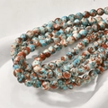 Macro detail of 8mm colorful sediment stone beads with natural texture for jewelry making - Blue Red Splatter (16#) / 8mm Diameter