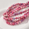 Macro shot of pink and white marble texture round beads in a white ceramic tray - Pink Pastel (11#) / 8mm Diameter