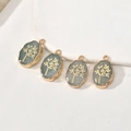 Detail van vier ovale kristallen hangers met gouden levensboommotoef voor DIY-sieraden - Groene Aventurijn Levensboom / Ongeveer 22*13mm