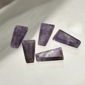 Macro detail of trapezoid cut natural purple amethyst stone pendants for jewelry making - Purple Crystal
