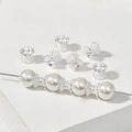 Close-up of silver-plated flower bead caps on a white pearl string for DIY jewelry making - 15# Silver Large Hole Flower Basket Spacer Bead