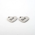 Polished heart-shaped stainless steel pendant with Dad lettering on white background - DAD Heart (AL65)