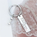 Portachiavi Drive safe in acciaio con manubrio su sfondo di pizzo rosa pastello - Stile Inciso Manubrio / Argento