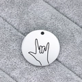 Polished stainless steel round pendant with engraved I Love You hand sign on plush background - I Love You Gesture (AL333)