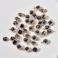 Detailed view of 14k gold plated four-leaf clover pendants with blue crystal stones - 16# Dark Blue Round Style