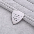 Macro detail of brushed stainless steel guitar pick with father's day engraving - Better Dad Style (AL224)
