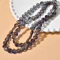 Close-up of heart-shaped iridescent glass beads with aurora borealis effect for DIY jewelry - Gray Purple Heart