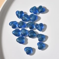 Close-up of royal blue heart-shaped glass beads with gold glitter for DIY jewelry making - 1 Piece / Sea Blue Gold Sand