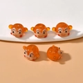 Detailed close-up of five amber glass monkey beads for DIY jewelry making - 17# Little Monkey / 11*19mm