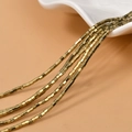 Primo piano di perline a cubo in ematite dorata da 2mm per la creazione di gioielli fai-da-te - Oro Chiaro