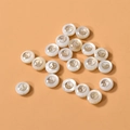 Detailed view of round white shell beads with gold-plated Tai Chi yin yang inlays - Bagua (2#) / 1 Piece / White