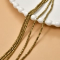 Golden 2mm hematite spacer beads for DIY jewelry making displayed on a ceramic dish - Deep Gold (21#)