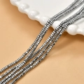 Macro detail of 2mm dark grey metallic hematite faceted square spacer beads for jewelry - White (23#)