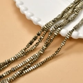 Macro shot of 2x4mm gold plated hematite block beads for DIY jewelry making - Gray Gold