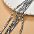 Macro shot of silver metallic hematite beads for DIY jewelry with high gloss finish - Silver