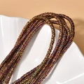 Macro view of metallic wave hematite spacer beads with colorful plated finish for DIY - 260 Pieces/Pack / Rose Gold Wave Spacer