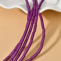 Macro detail of 4x13mm purple turquoise tube beads for DIY jewelry making material - Purple