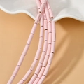 Macro view of 4x13mm pink turquoise tube beads with natural texture for DIY jewelry - Pink