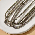 Macro shot of 3mm triangle hematite spacer beads with iridescent metallic rainbow finish - 1 Strand (Approx. 350 Pcs) / 2# Pale Green Triangle