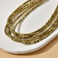 Modern layered gold-tone necklace with rectangular block links on a white stone display - 1 Strand (Approx. 350 Pcs) / 4# Gold Triangle