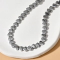 Macro shot of 6mm faceted heart hematite beads for DIY jewelry making on white tray - 3# White Gold Color Faceted Heart (Approx. 70 Pcs/Strand)