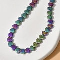 Macro shot of 6mm faceted heart-shaped beads with iridescent chameleon plating finish - 7# Iridescent Faceted Heart (Approx. 70 Pcs/Strand)