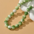 Macro detail of 6/8mm green and white marble effect Persian jade beads for jewelry making - 12mm (Approx. 34 Pieces) / Green and White Smudged