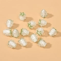 Detailed view of handmade strawberry glass beads with white base and green leaves - White Strawberry