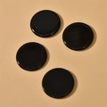 Close-up of four polished black agate 30mm round stone pendants for DIY jewelry making - Black Agate