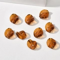 Detailed view of amber twisted leaf glass beads with central hole for DIY jewelry making - 1 Piece Pack / Amber
