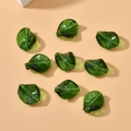 Macro shot of 9 dark green translucent leaf-shaped glass beads for DIY jewelry making - 1 Piece Pack / Dark Green