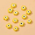 Macro shot of yellow flower-shaped millefiori beads with center dots for DIY jewelry making - 16# Yellow Millefiori Bead
