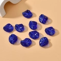 Macro detail of ten dark blue twisted glass leaf beads with translucent rippled texture - 1 Piece Pack / Royal Blue