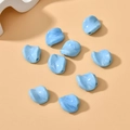 Macro shot of light blue twisted leaf beads with marble texture for DIY jewelry making - 1 Piece Pack / Lake Blue Ceramic Color