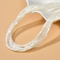 Close-up of multilayer natural freshwater shell beads for jewelry making projects - 3x5mm (Approx. 80 Beads/Strand) / White