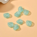 Close-up of light green translucent twisted leaf glass beads for DIY jewelry making - 1 Piece Pack / Lake Blue Jade Color