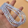 Close-up of light blue AB glass square tube beads for DIY jewelry making and crafts - Aurora Sky Blue Square 4mm