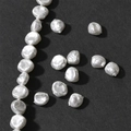 Macro close-up of white Baroque irregular petal-shaped pearls with a natural luster finish - 14# Small Petal Shape (1 Pc, Approx 7*8mm)