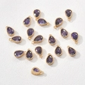 Macro view of purple teardrop zircon charms with 14k gold plated beaded frames for DIY - Dark Purple Teardrop