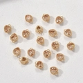 Detailopname van champagne hartvormige edelstenen in goudzetting voor DIY sieraden - Champagne Zirkonia Hart