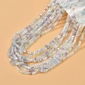 Macro shot of 2mm macaron colored cubic crystal glass beads for DIY jewelry making - Ice Cream Pink AB