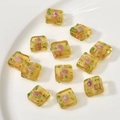 Translucent amber glass cube beads with pink rose and green polka dot floral patterns - Honey Color