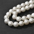 Elegant white cotton pearl necklace with textured silk finish on dark gray background - 12mm (Approx 35 Beads)