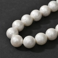 Macro shot of white cotton pearl beads with unique textured finish for DIY jewelry - 14mm (Approx 28 Beads)