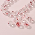 Close-up of red and white polka dot heart glass beads for DIY jewelry making - Magic Wand Round Bead