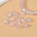 Macro detail of 8mm light pink translucent square glass beads with silver foil for DIY - Pink